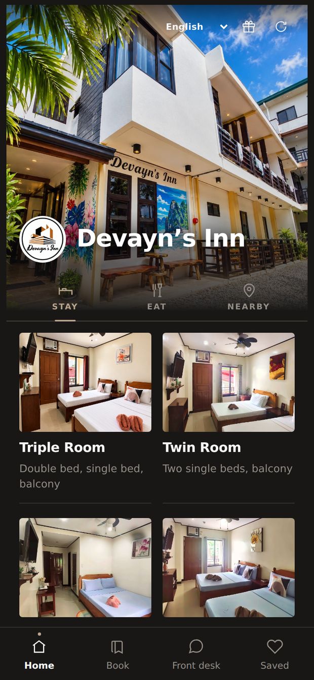 Devayn’s Inn’s own app: her photograph of the inn with its sign, her logo, and her rooms.